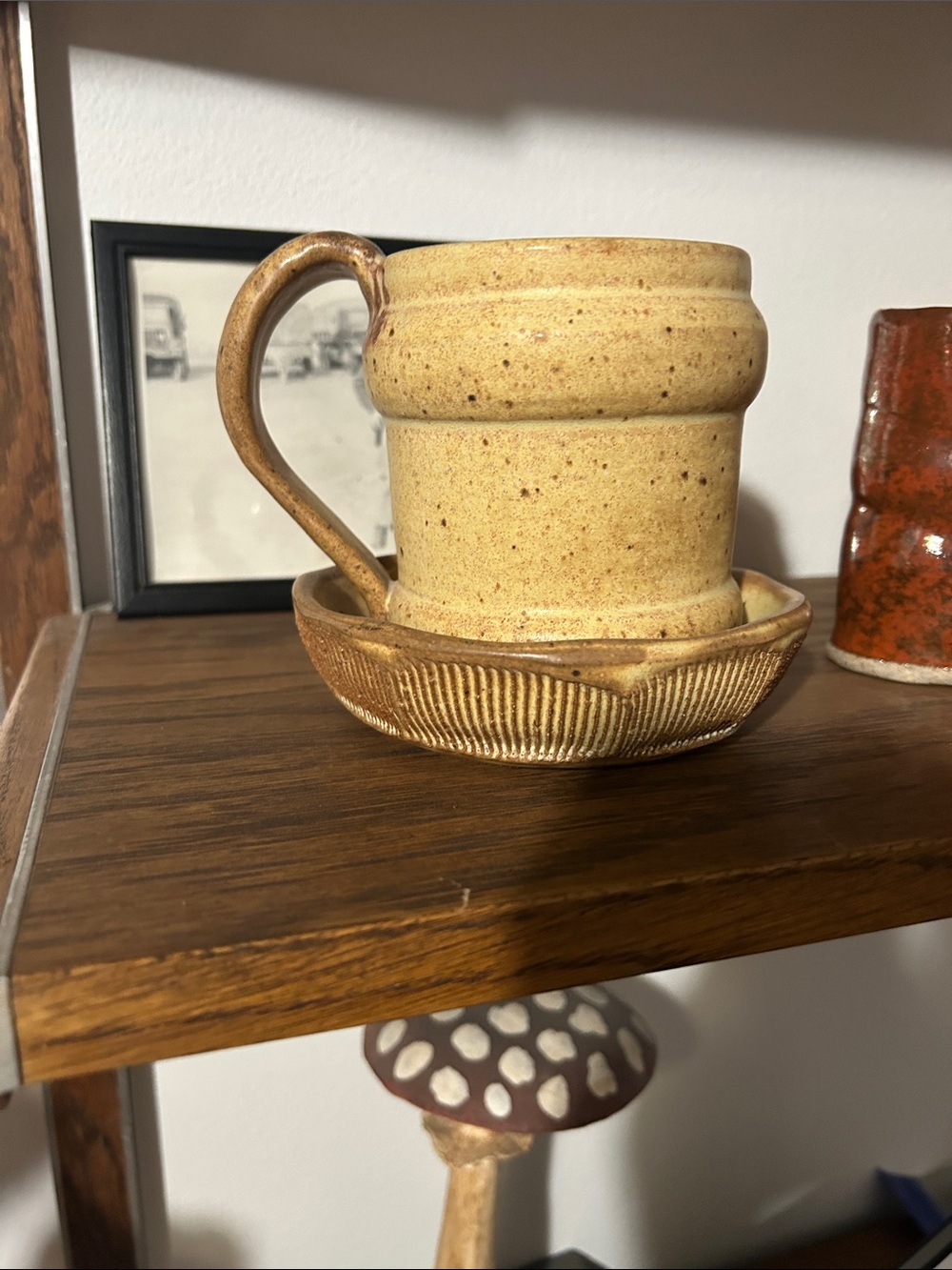 Pottery mug and saucer